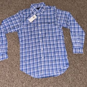 Blue and white plaid polo shirt.